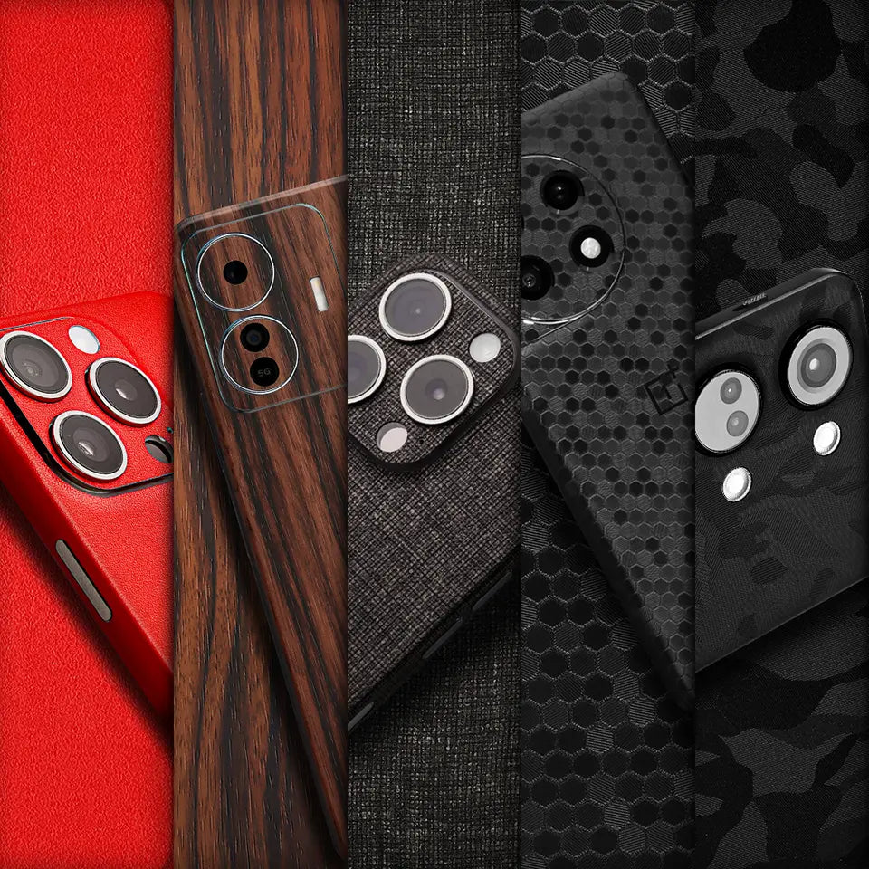 Close-up of a display of several mobile phone skins in different materials and finishes. The materials include wood, carbon fiber, matrix, leather, and fabric.