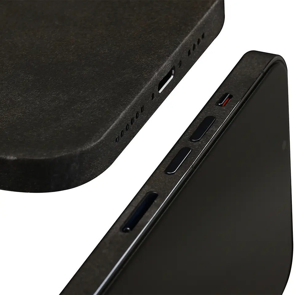 Close-up of a mobile phone showing a black skin applied to the bottom and side where skin has precision cut outs for the power buttons, charging port and headphone jack.